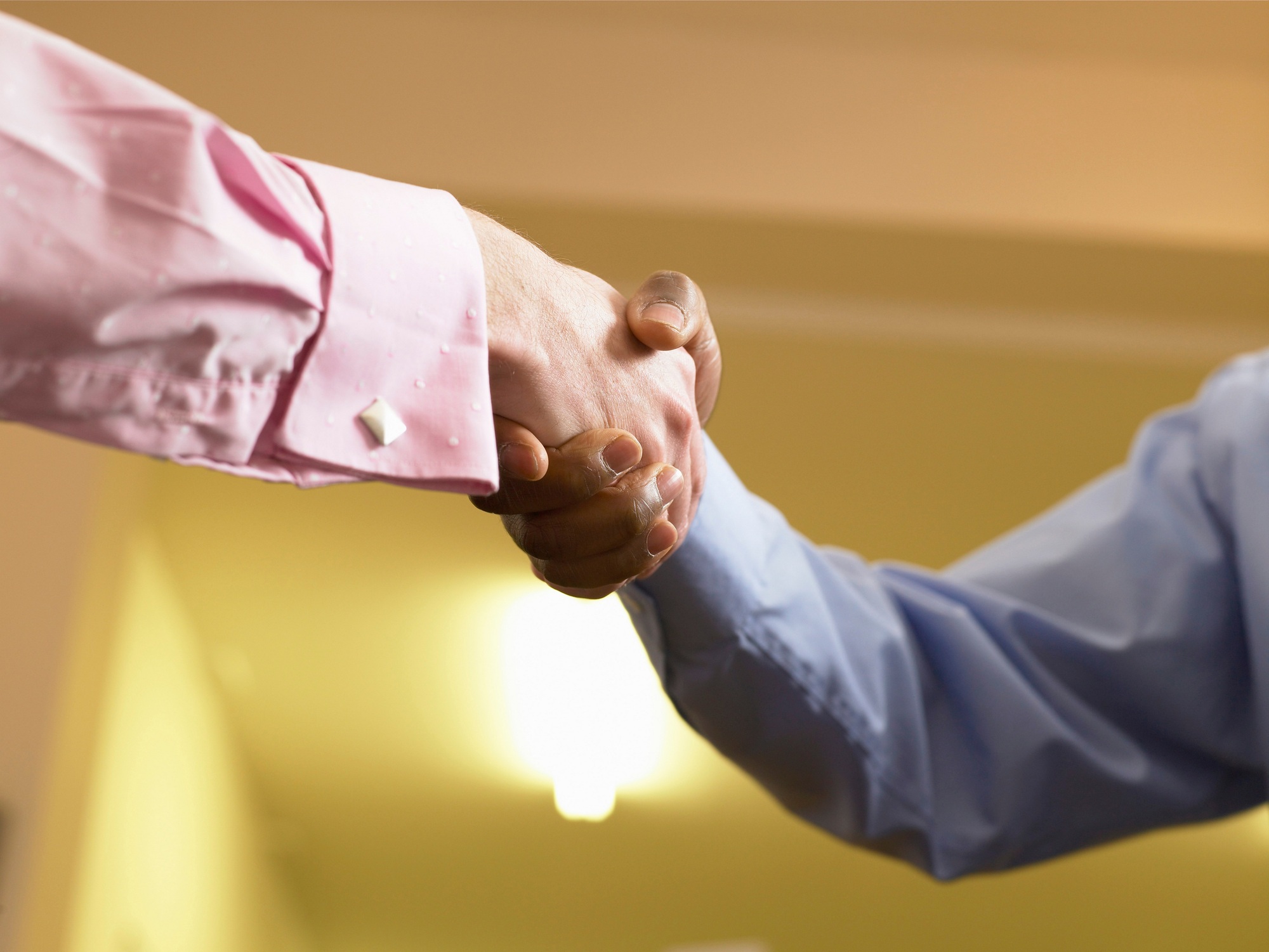 Close up of businessmen shaking hands